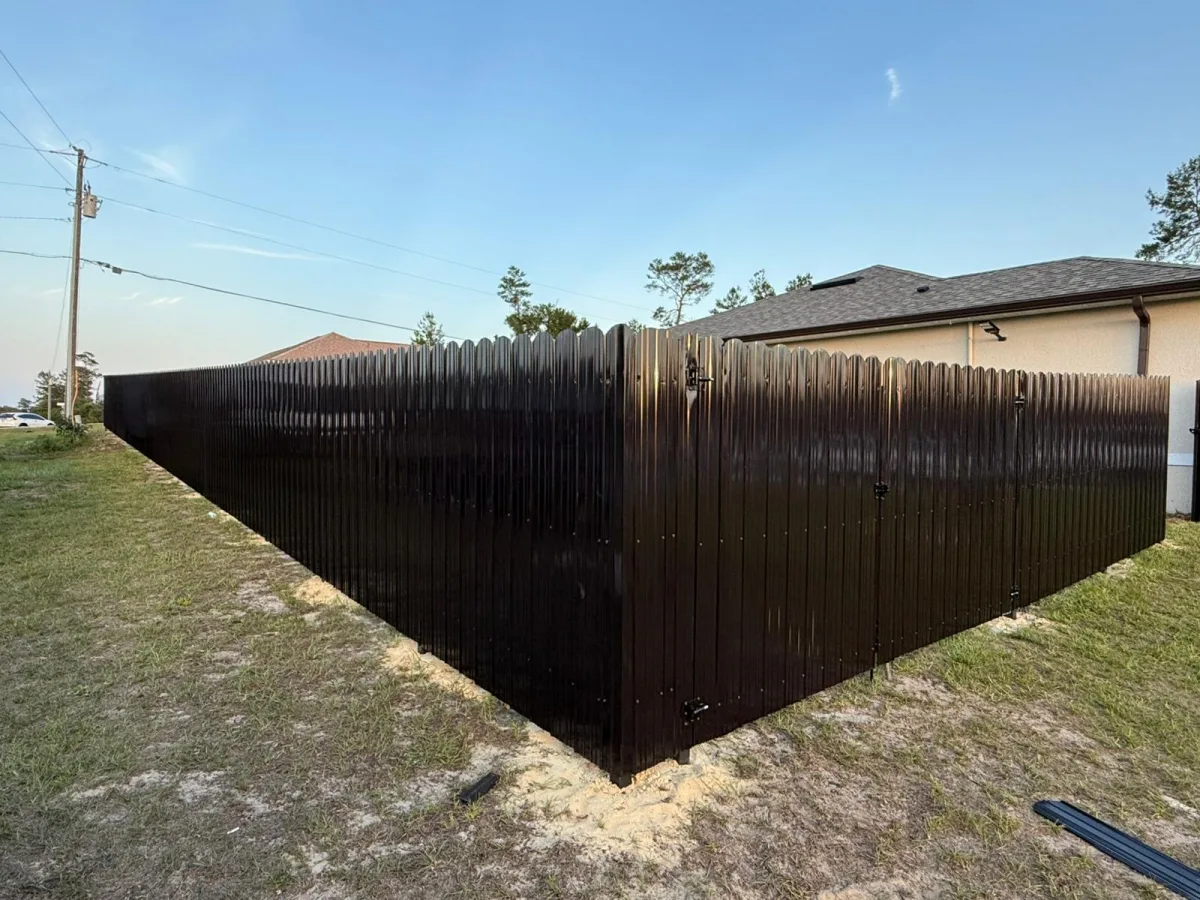 Black Dura Fence corner with gate at golden hour — Ocala FL