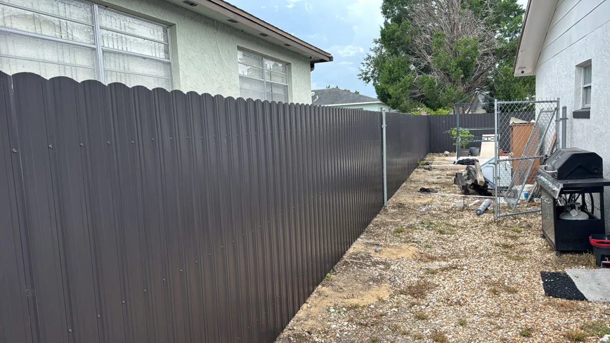 Black Dura Fence narrow side yard between two homes — Marion County FL